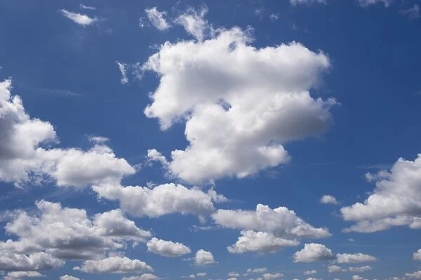 Cumulus clouds in blue sky, Cumbria, England, June