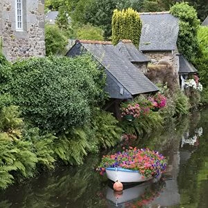 Decorative floral boat in river, Pontrieux, Cotes-d Armor, Brittany, France, September