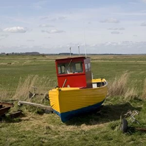 Freshly painted fishing boat on shore, Aldeburgh, Suffolk, England, april