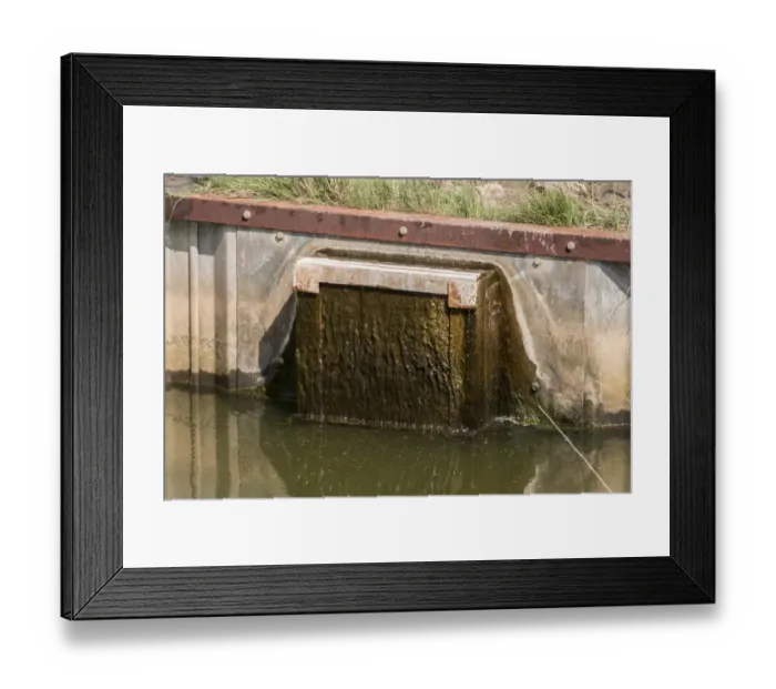Framed Print : Sluice gate used to controle water levels at Deepdale marsh Norfolk