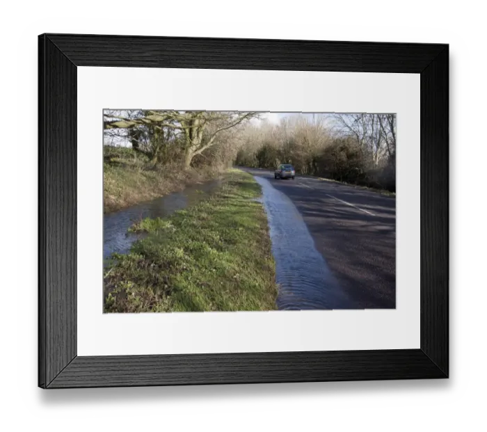 Framed Print : Flooded ditch overflowing into road, Aldingbourne, near Bognor Regis, West Sussex, England, February 2014 Framed Print : Flooded ditch overflowing into road, Aldingbourne, near Bognor Regis, West Sussex, England, February 2014
