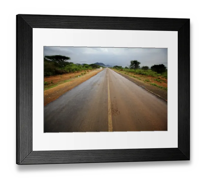 Framed Print : View of road through bush habitat after rainfall, with mountain range in distance, South Pare Mountains Framed Print : View of road through bush habitat after rainfall, with mountain range in distance, South Pare Mountains