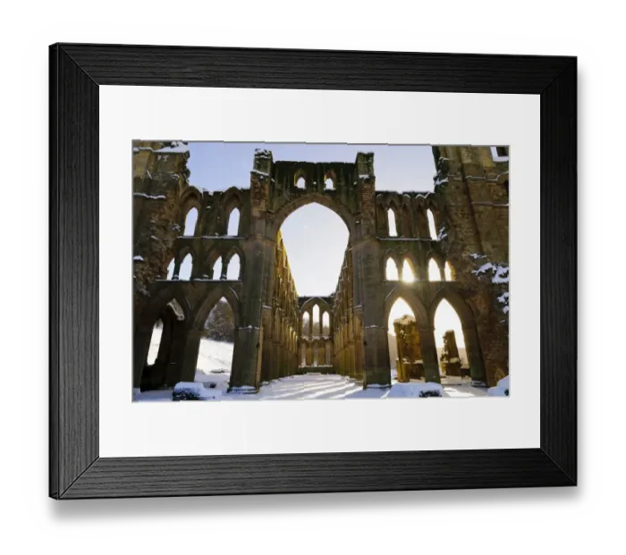 Framed Print : Sunlight shining through arched windows of ruined cistercian abbey in snow, Rievaulx Abbey, North York Moors N. P Framed Print : Sunlight shining through arched windows of ruined cistercian abbey in snow, Rievaulx Abbey, North York Moors N. P