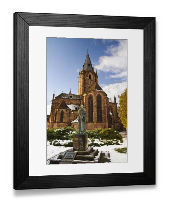 Framed Print : Statue of Benedictine monk and Roman Catholic church in snow, St. Peter and St