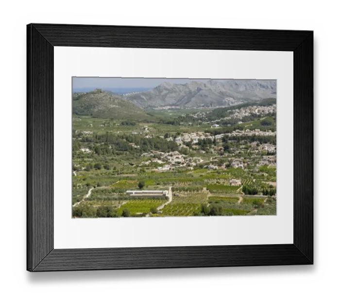 Framed Print : View of countryside with farmland and holiday villas from hills towards coastline, near Denia, Marina Alta Framed Print : View of countryside with farmland and holiday villas from hills towards coastline, near Denia, Marina Alta