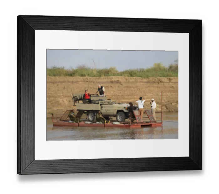Framed Print : Safari vehicle and tourists crossing river on pontoon, River Luangwa, South Luangwa N. P. Zambia, June