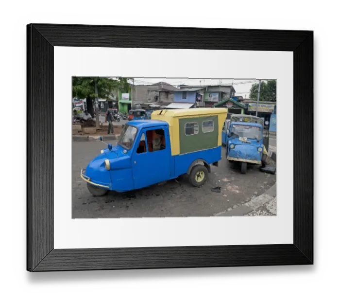 Framed Print : Blue tuk tuk three-wheeler vans on road in city, Manggarai District, Jakarta, Java, Indonesia, December Framed Print : Blue tuk tuk three-wheeler vans on road in city, Manggarai District, Jakarta, Java, Indonesia, December