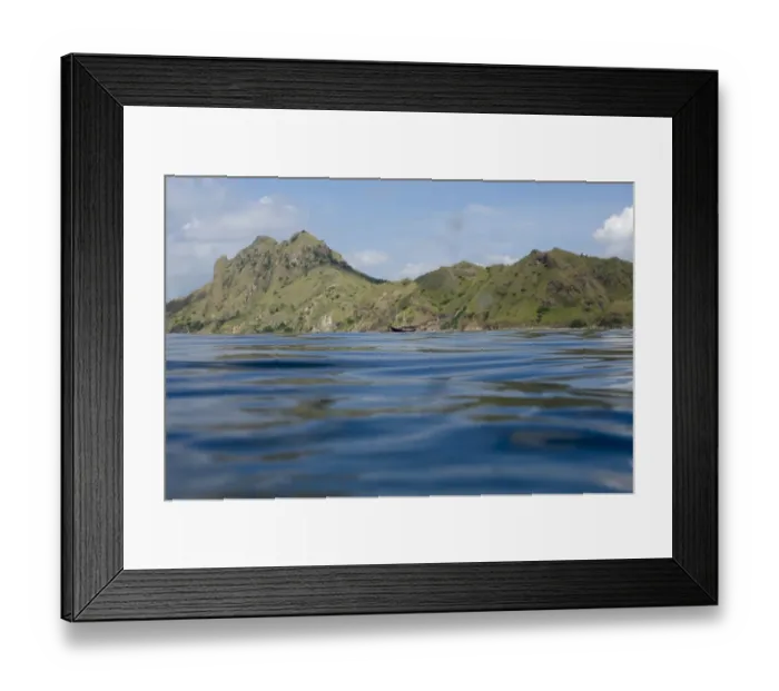 Framed Print : View of coastline with hills and ship from surface of sea, Mobula Point dive site, Padar Island, Komodo N. P Framed Print : View of coastline with hills and ship from surface of sea, Mobula Point dive site, Padar Island, Komodo N. P