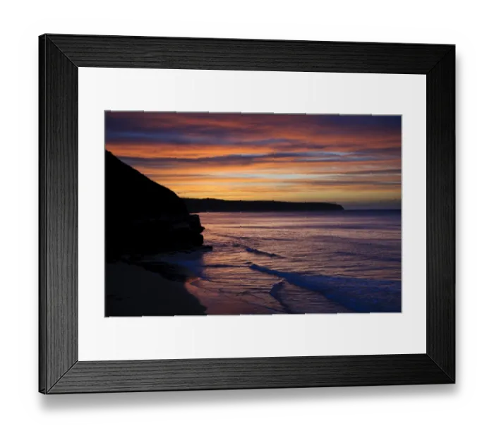 Framed Print : View of coastline silhouetted at sunset, looking from West Pier, Whitby, North Yorkshire, England, April Framed Print : View of coastline silhouetted at sunset, looking from West Pier, Whitby, North Yorkshire, England, April