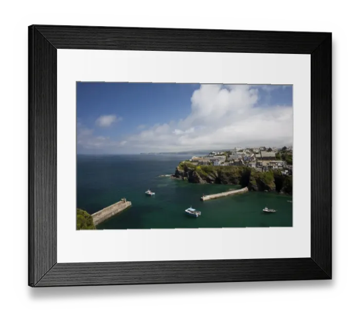 Framed Print : View of coastal fishing village with fishing boats at sea, looking towards Tintagel in distance, Port Isaac, Cornwall Framed Print : View of coastal fishing village with fishing boats at sea, looking towards Tintagel in distance, Port Isaac, Cornwall