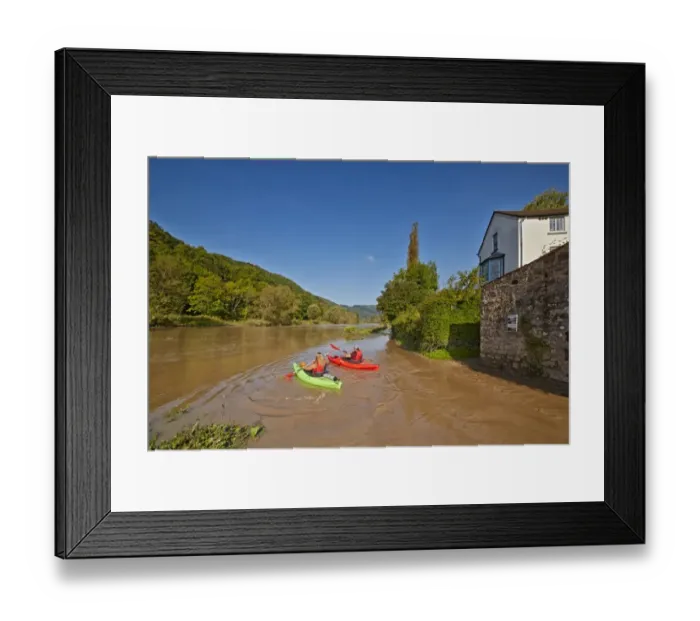 Framed Print : Kayakers on river, with high tide causing flooding, Brockweir, River Wye, Forest of Dean, Gloucestershire, England