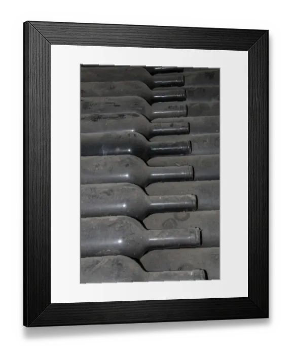Framed Print : Dust covered old bottles of wine. Guasti Clemente of Nizza Northan Italy