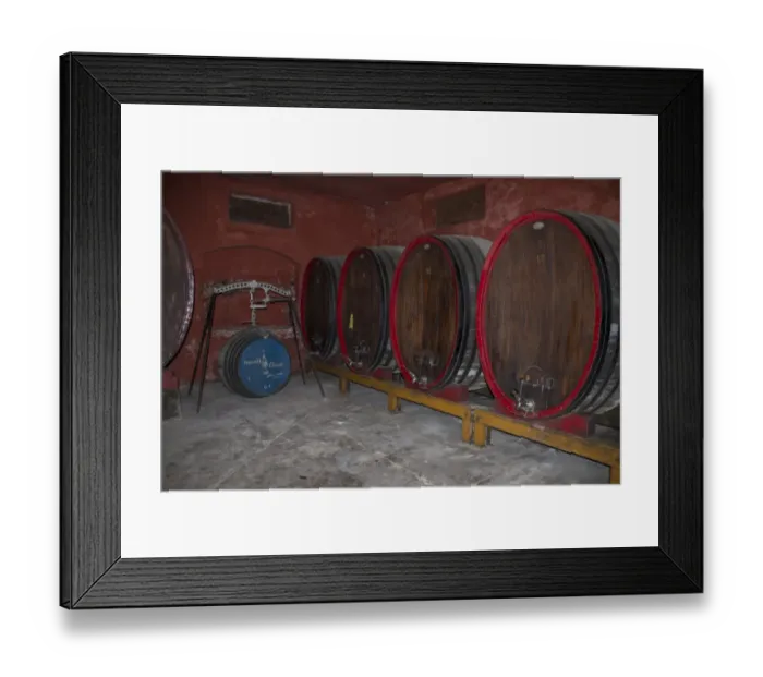 Framed Print : Large oval shaped oak wine casks used for maturing Guasti Clemente wines. Nizza Italy