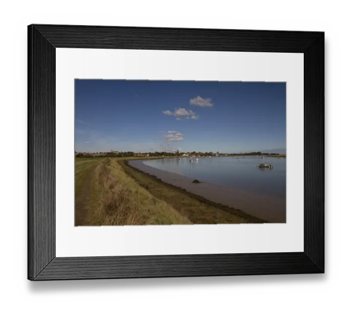 Framed Print : Looking along the footpath north towards the Suffolk village of Orford, on the edge of the River Ore with exposed river