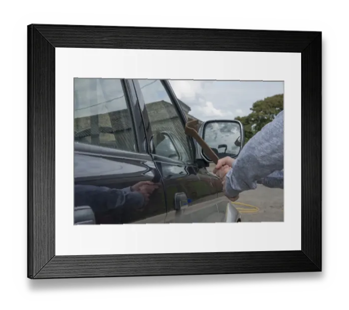 Framed Print : Man trying to break pick-up window with metal bar in farmyard, Lancashire, England, August Framed Print : Man trying to break pick-up window with metal bar in farmyard, Lancashire, England, August