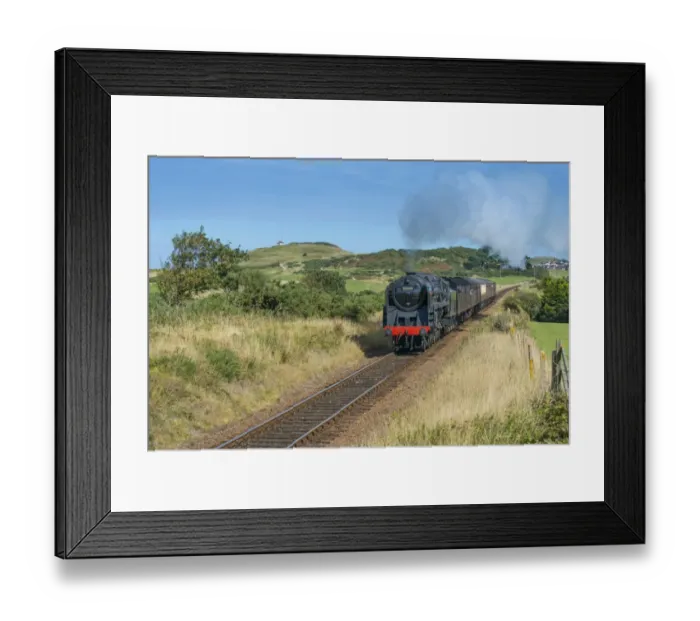 Framed Print : Steam train and carriages, passing through golfcourse with seaside town in background, North Norfolk Railway Framed Print : Steam train and carriages, passing through golfcourse with seaside town in background, North Norfolk Railway