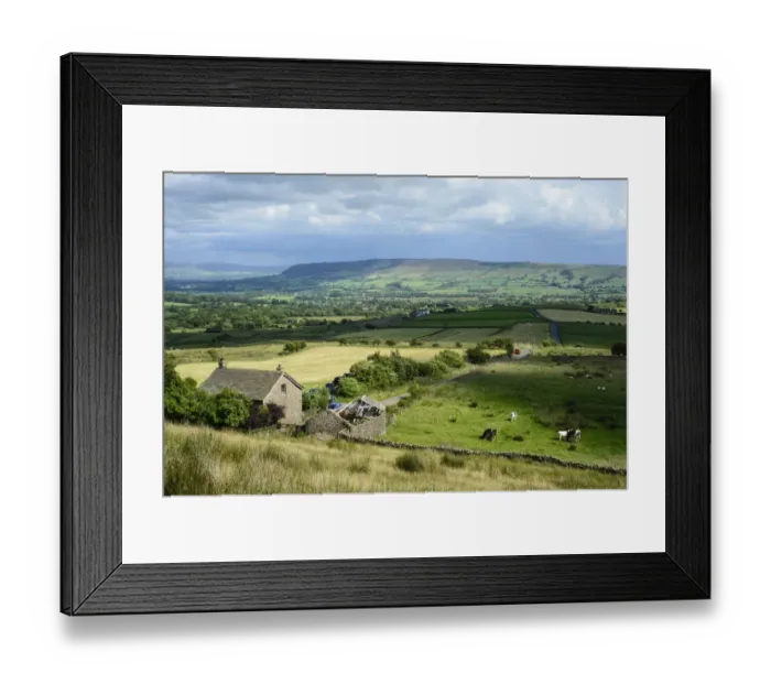 Framed Print : View across farmland with cattle grazing in pasture towards distant fells Framed Print : View across farmland with cattle grazing in pasture towards distant fells