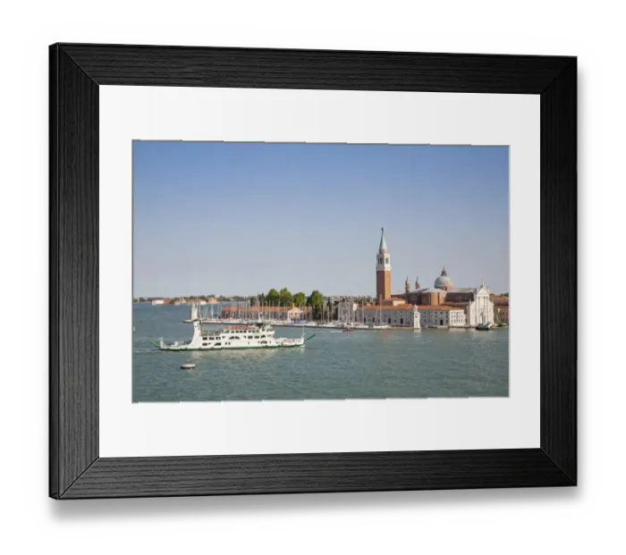 Framed Print : View across waterway towards tourist boat and 16th century Benedictine church, Church of San Giorgio Maggiore Framed Print : View across waterway towards tourist boat and 16th century Benedictine church, Church of San Giorgio Maggiore