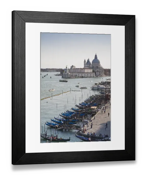 Framed Print : View of gondolas moored along waterfront with Roman Catholic church in background, Santa Maria della Salute Framed Print : View of gondolas moored along waterfront with Roman Catholic church in background, Santa Maria della Salute