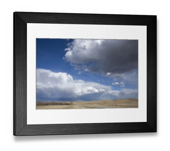 Framed Print : Cumulus congestus clouds over road through prairie, North Dakota, U. S. A. April Framed Print : Cumulus congestus clouds over road through prairie, North Dakota, U. S. A. April