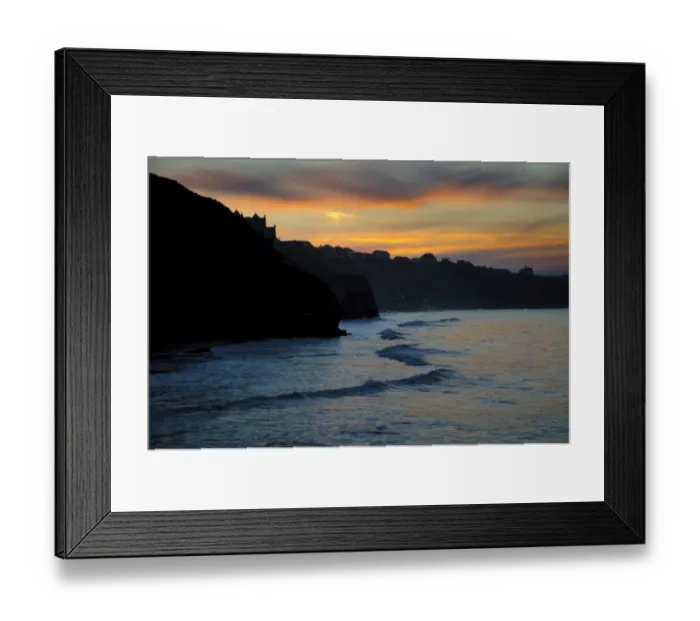 Framed Print : View of sea cliffs and clifftop seaside town silhouetted at sunset, West Cliff, Whitby, North Yorkshire, England, March Framed Print : View of sea cliffs and clifftop seaside town silhouetted at sunset, West Cliff, Whitby, North Yorkshire, England, March
