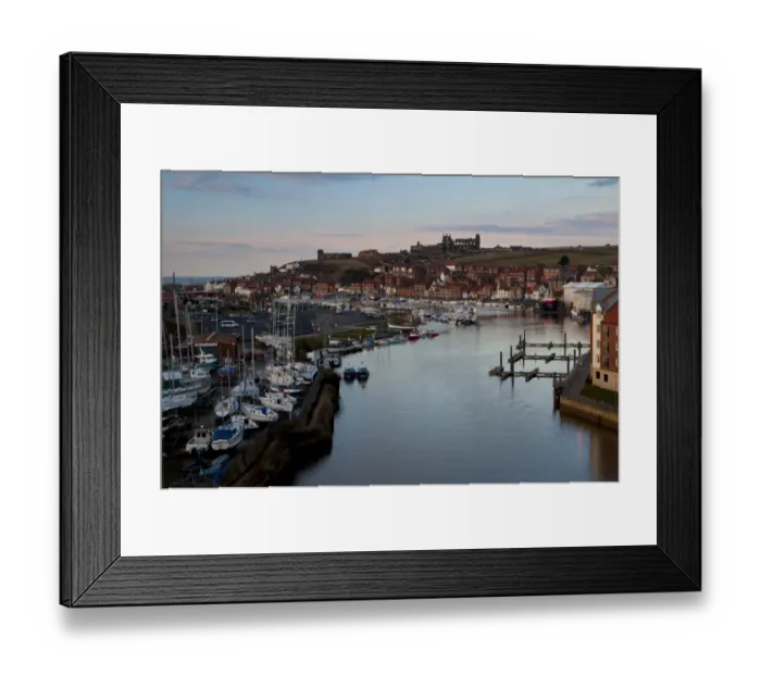 Framed Print : View of seaside town with boats moored on river at dusk, with St. Marys Church Framed Print : View of seaside town with boats moored on river at dusk, with St. Marys Church