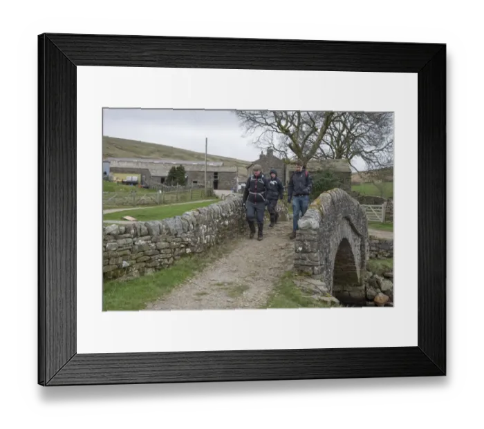 Framed Print : Walkers crossing bridge near farmyard on Coast to Coast Walk, Ravenseat, Keld, Richmond, Swaledale Framed Print : Walkers crossing bridge near farmyard on Coast to Coast Walk, Ravenseat, Keld, Richmond, Swaledale
