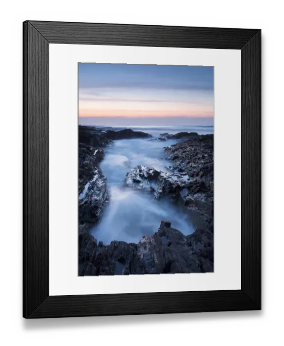 Framed Print : View of sea washing into large rockpool during incoming tide at sunset, Westward Ho!, North Devon, England, March Framed Print : View of sea washing into large rockpool during incoming tide at sunset, Westward Ho!, North Devon, England, March