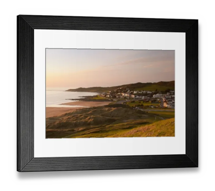 Framed Print : View of coastline and seaside resort at sunset, with Morte Point in distance, viewed from Potters Hill, Woolacombe Framed Print : View of coastline and seaside resort at sunset, with Morte Point in distance, viewed from Potters Hill, Woolacombe