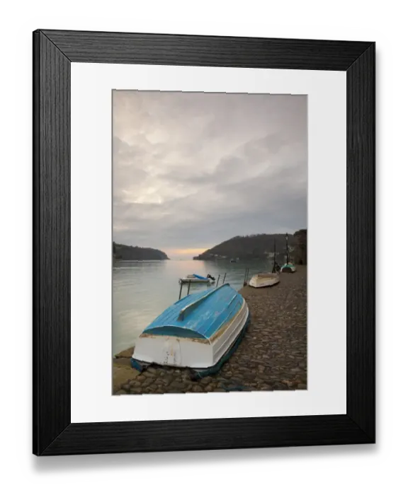 Framed Print : Small dinghies laying upside down on cobbled quay, with overcast sky at sunrise, Dartmouth Harbour, Dartmouth, Devon Framed Print : Small dinghies laying upside down on cobbled quay, with overcast sky at sunrise, Dartmouth Harbour, Dartmouth, Devon