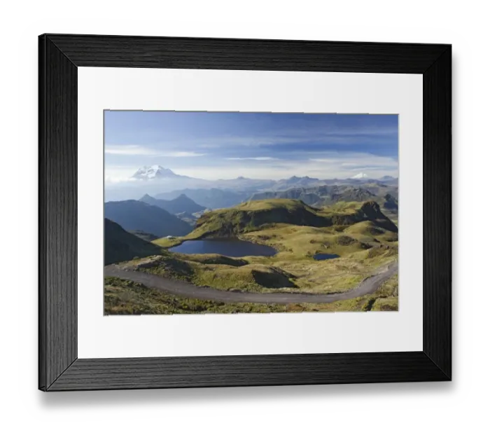 Framed Print : View of road through mountain pass, with snow capped volcanoes in distance, Papallacta Pass, Andes, Ecuador, November