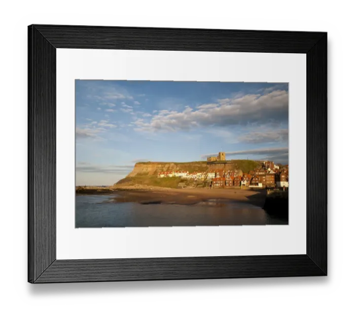 Framed Print : View of beach and seaside town in evening sunlight, with St. Marys Church on clifftop in background, East Cliffs Framed Print : View of beach and seaside town in evening sunlight, with St. Marys Church on clifftop in background, East Cliffs