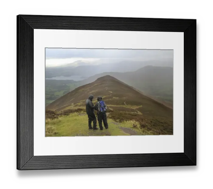 Framed Print : Walkers wearing waterproof clothing, looking at map during rain shower, view from Causey Pike Framed Print : Walkers wearing waterproof clothing, looking at map during rain shower, view from Causey Pike