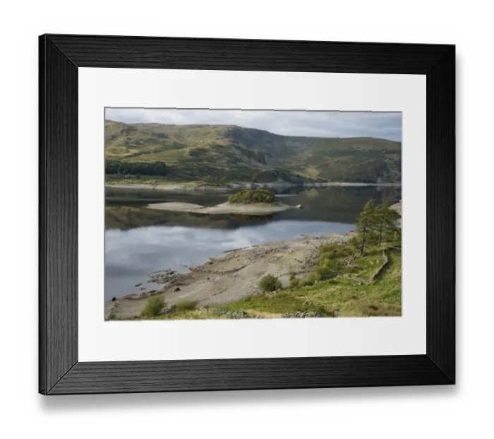 Framed Print : View of upland reservoir with low water level and remains of submerged village exposed after dry summer, Mardale Green Framed Print : View of upland reservoir with low water level and remains of submerged village exposed after dry summer, Mardale Green