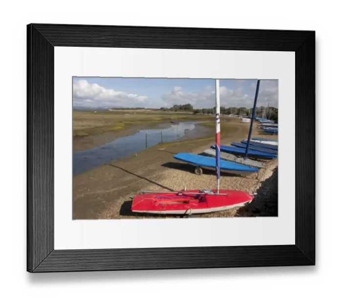 Framed Print : Dinghies moored beside coastal creek at low tide, Roman Landing, East Head Creek, West Wittering, Manhood Peninsula