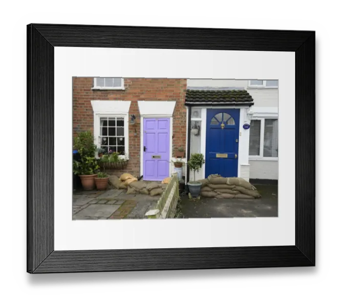 Framed Print : Sandbags piled against house doors during river flood, River Thames, Chertsey, Surrey, England, February 2014 Framed Print : Sandbags piled against house doors during river flood, River Thames, Chertsey, Surrey, England, February 2014