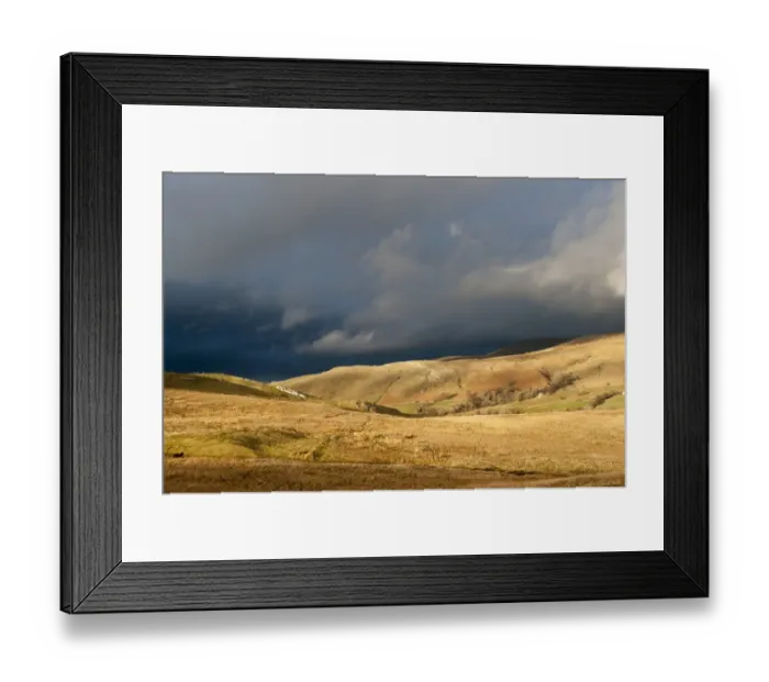 Framed Print : View of fells in evening sunlight, with distant stormclouds, near Kirkby Stephen, Cumbria, England, March Framed Print : View of fells in evening sunlight, with distant stormclouds, near Kirkby Stephen, Cumbria, England, March