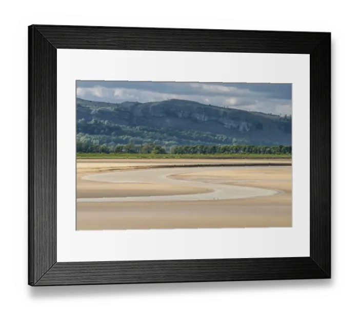 Framed Print : River meandering through sands of estuary at low tide, looking from Sandside, River Kent, Kent Estuary, Cumbria