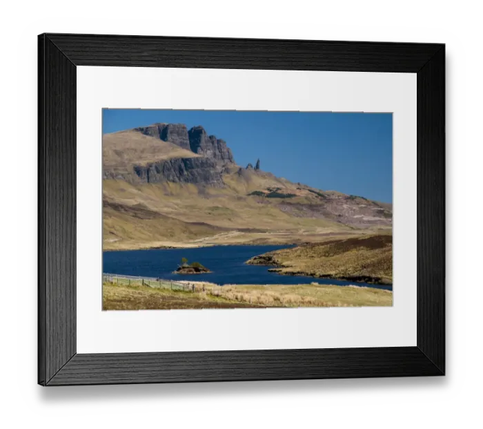 Framed Print : View across freshwater loch towards rocky hill with rock pinnacle, Loch Fada, Old Man of Storr, The Storr Framed Print : View across freshwater loch towards rocky hill with rock pinnacle, Loch Fada, Old Man of Storr, The Storr