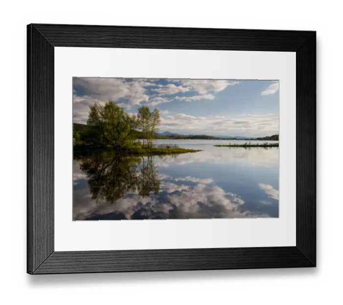 Framed Print : View of freshwater loch with clouds and trees reflected in still water, Loch Insh, Cairngorms N. P