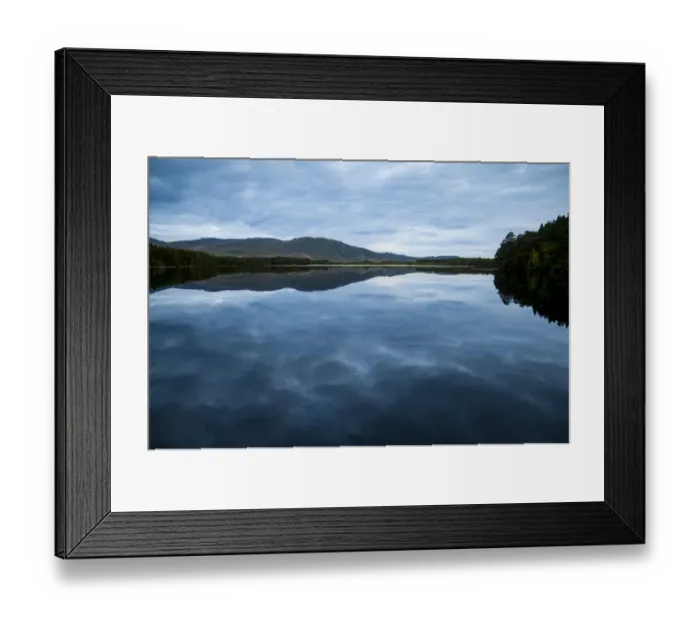 Framed Print : View of freshwater loch with cloudy sky reflected in still water at dusk, Loch Garten, Abernethy Forest N. N. R