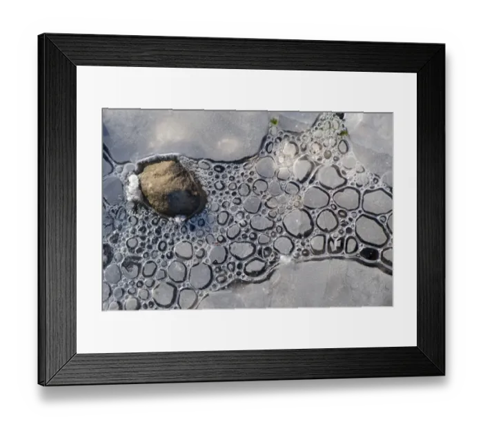 Framed Print : Close-up of ice formed around stone at edge of lake, Semerwater, Wensleydale, Yorkshire Dales N. P