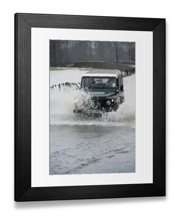 Framed Print : Land Rover driving through flooded road, Cumbria, England, December Framed Print : Land Rover driving through flooded road, Cumbria, England, December
