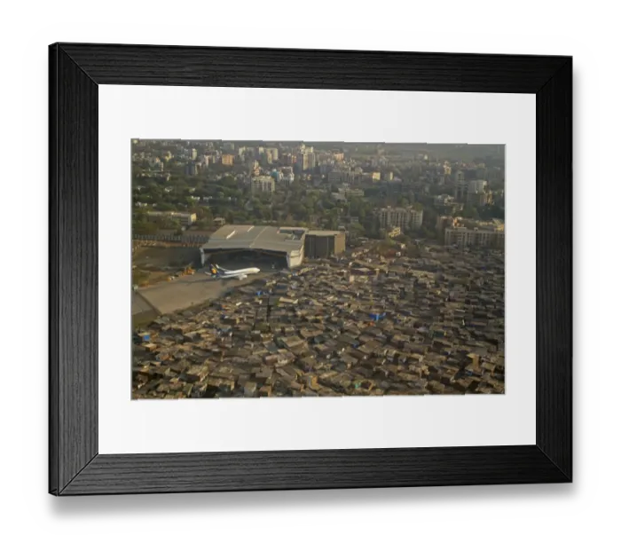 Framed Print : Aerial view of slum areas surrounded by luxury apartments, offices and airport, India, February
