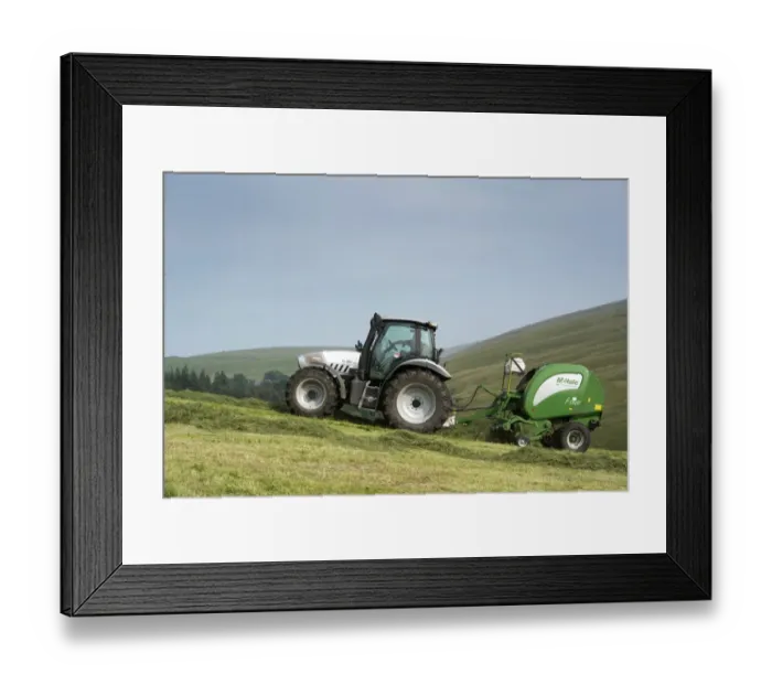 Framed Print : Hurlimann tractor with McHale round baler, baling on steep upland meadow, Cumbria, England, July Framed Print : Hurlimann tractor with McHale round baler, baling on steep upland meadow, Cumbria, England, July