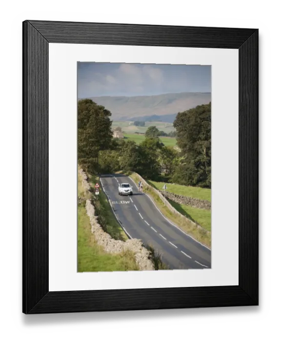 Framed Print : Country road with car passing cyclists, near Hawes, Wensleydale, Yorkshire Dales N. P Framed Print : Country road with car passing cyclists, near Hawes, Wensleydale, Yorkshire Dales N. P