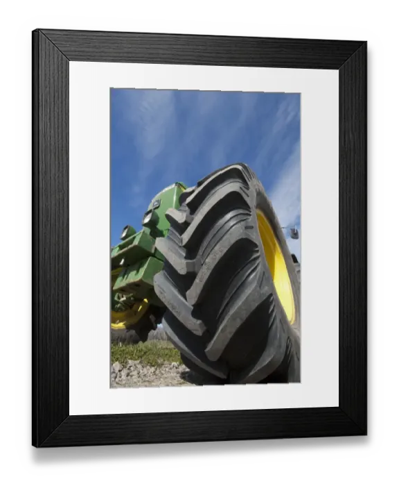 Framed Print : John Deere 4455 tractor, close-up of wheel, Sweden, may Framed Print : John Deere 4455 tractor, close-up of wheel, Sweden, may