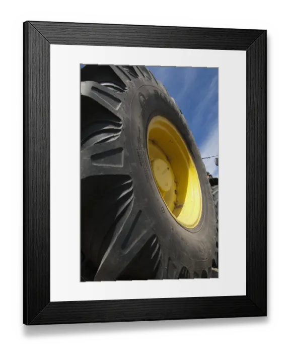 Framed Print : John Deere 4455 tractor, close-up of wheel, Sweden, may Framed Print : John Deere 4455 tractor, close-up of wheel, Sweden, may