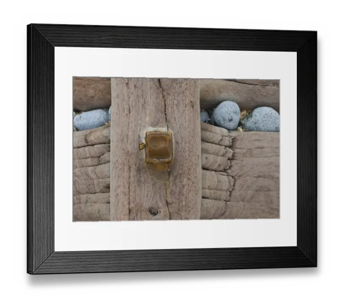 Framed Print : Groynes, abstract view of rusty bolt and pebbles stuck in weathered timber, West Runton, Norfolk, England Framed Print : Groynes, abstract view of rusty bolt and pebbles stuck in weathered timber, West Runton, Norfolk, England