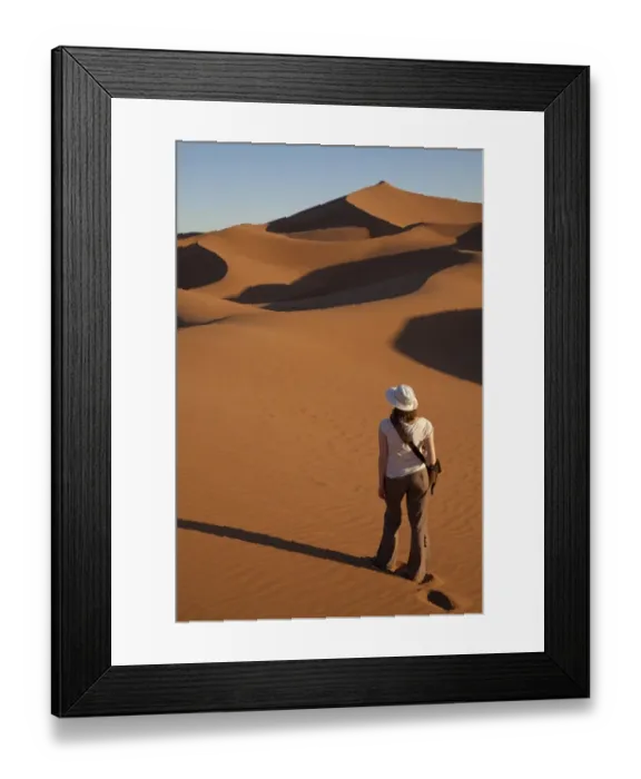 Framed Print : Tourist standing on desert sand dunes, Erg Chegaga, Sahara, Morocco, may Framed Print : Tourist standing on desert sand dunes, Erg Chegaga, Sahara, Morocco, may